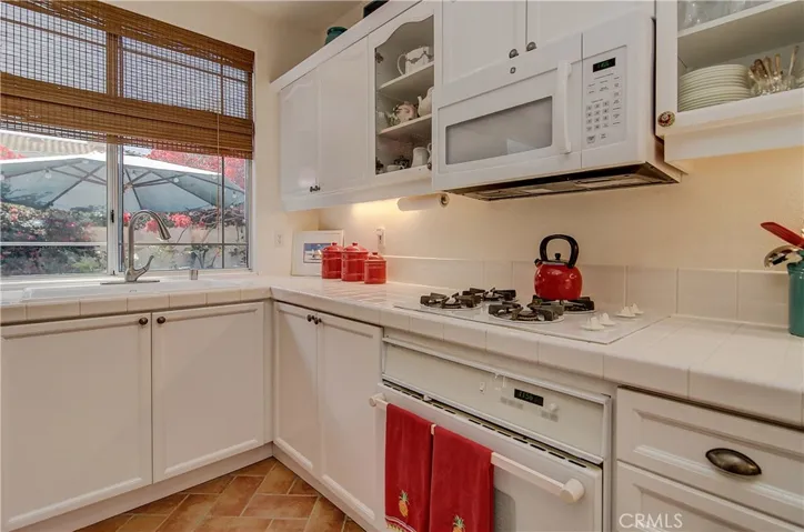 Crisp white color scheme adds a fresh tone to the kitchen.
