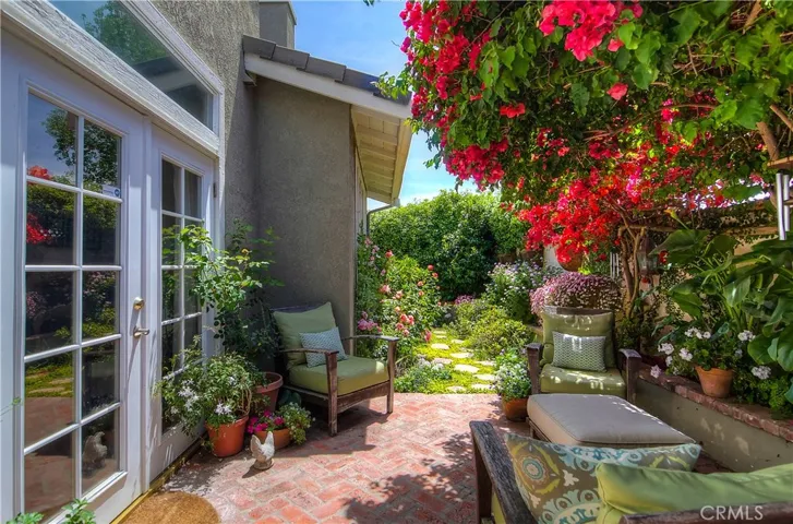 French doors open to the Secluded back yard and Garden.