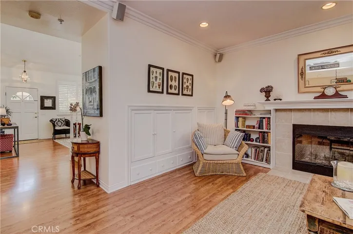 Fireplace, crown molding,  recessed lights and tons of storage in the family room.