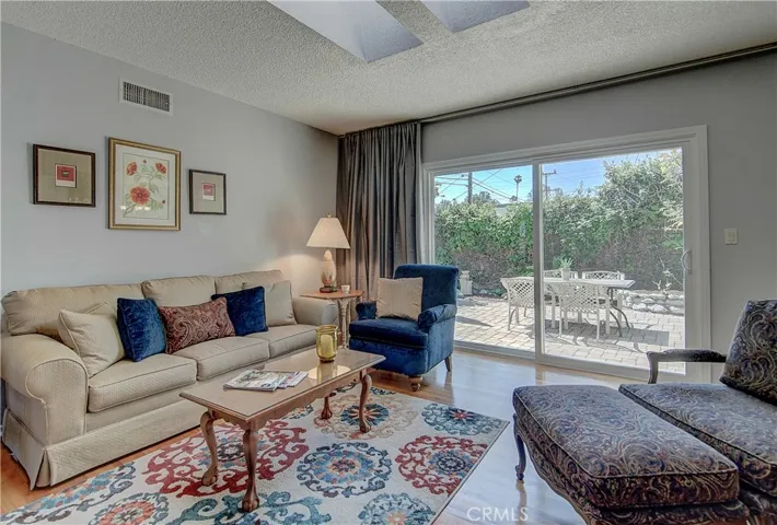 Indoor-Outdoor So. Cal.. Lifestyle prevails with multiple sets of Sliding Doors to rear Terrace.