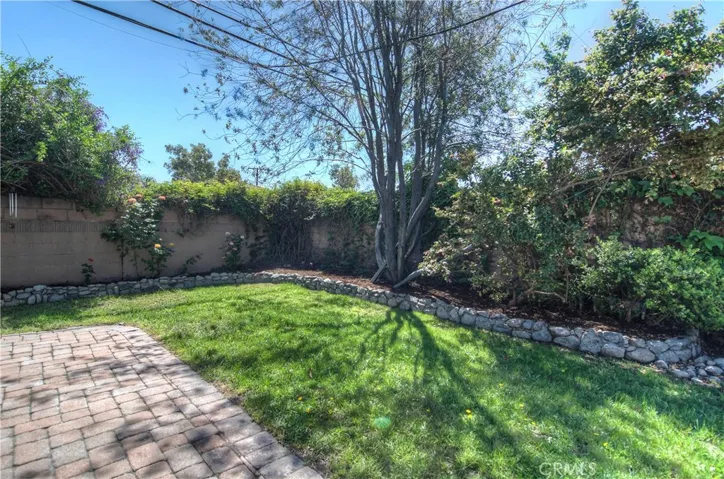 Patio and grass,perfect combo! this is just off the master suite.