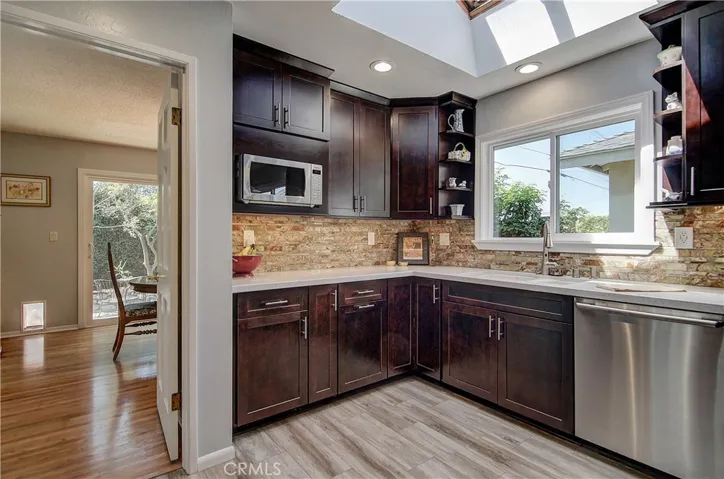 Contemporary Stone back splash adds a lovely accent.