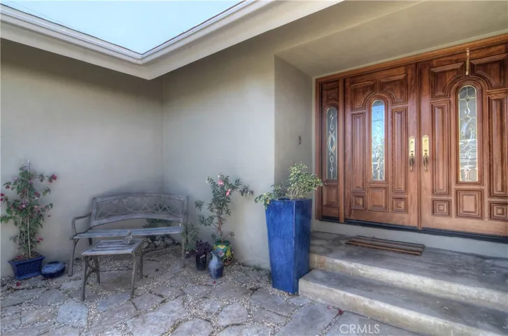 Private Front Courtyard and Gorgeous Double Front Doors set the tone as one approaches..Welcome!