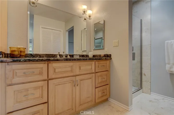 Light Cabinetry and more Travertine/Granite..ahhh!