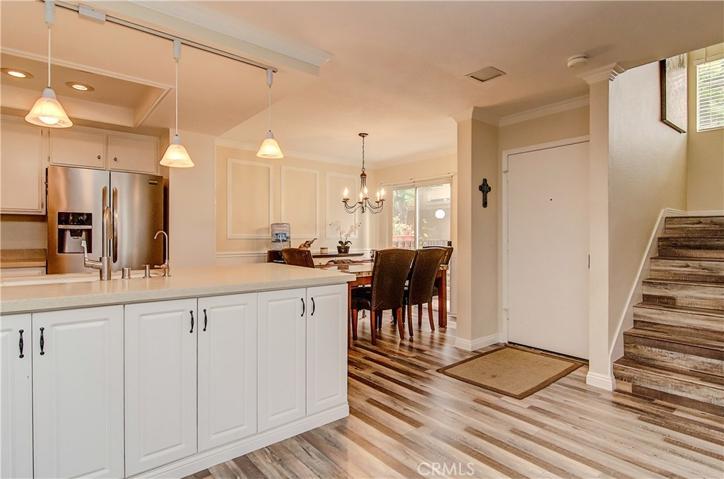 TONS OF STORAGE under the Breakfast/Wine Bar. Check out these high end floors, gorgeous!