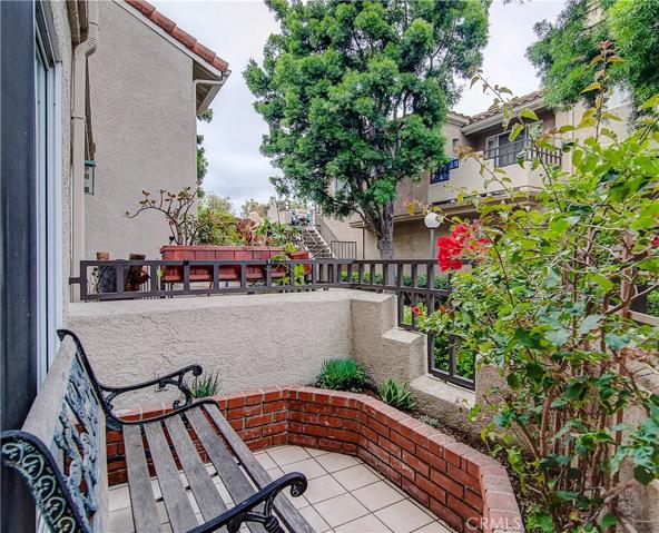 INVITING FRONT PATIO, perfect to relax and have a veggie garden perhaps. Let's tour the whole house now....