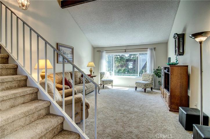 Soaring ceilings and NEW Carpet add volume and a light feel to the already spacious Living Room.