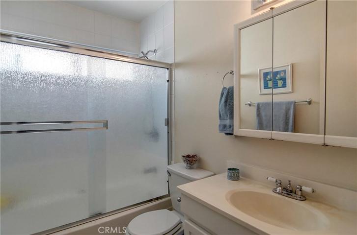 Downstairs hall bath is spotless., ready for your personalization.