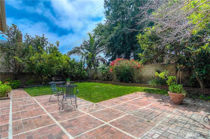 AHHHHH...Blue skies, brick terrace, lush landscape, and ocean breezes...Southern California living at it's best!