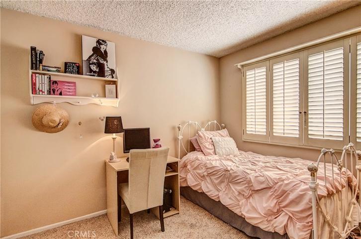 Large kids/guest room in separate wing, adjacent to hall bath.