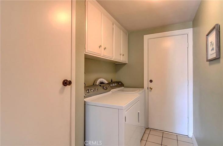 Convenient inside laundry room with more storage and access to gigantic three car garage.