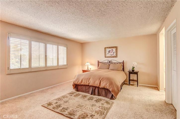 Large master bedroom has plenty of room for any furniture needs, plus extra lounging space.