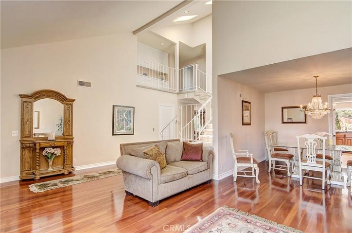 Skylit stairwell with upper gallery adds a dramatic effect to this executive home.