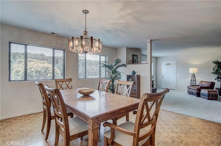 The light filled Formal Dining Room opens to Family Room.