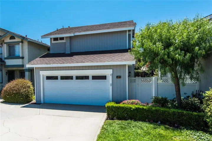 Nestled in a private cul-de-sac, this home’s curb appeal & desired layout with main floor bedroom makes a striking impression! Attached 2-car garage is upgraded with built-in cabinets & workbench, and new garage door opener.