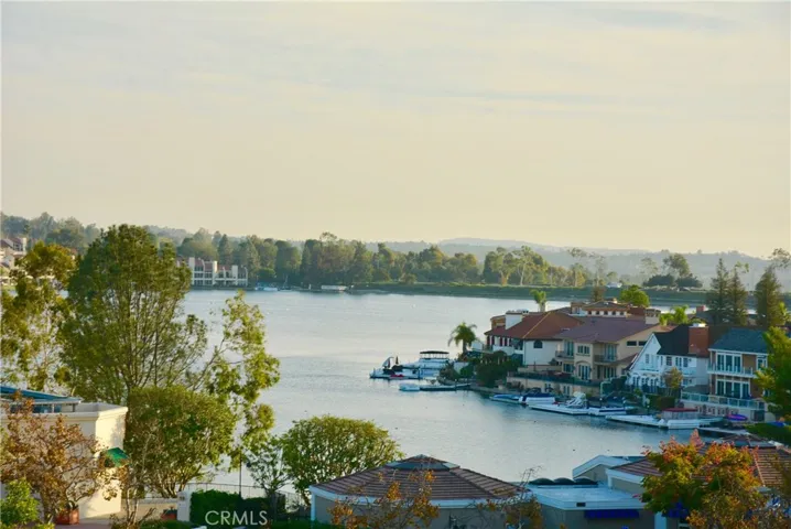 This view is both tranquil and beautiful--the hills and city lights rim the shimmering waters of Lake Mission Viejo.