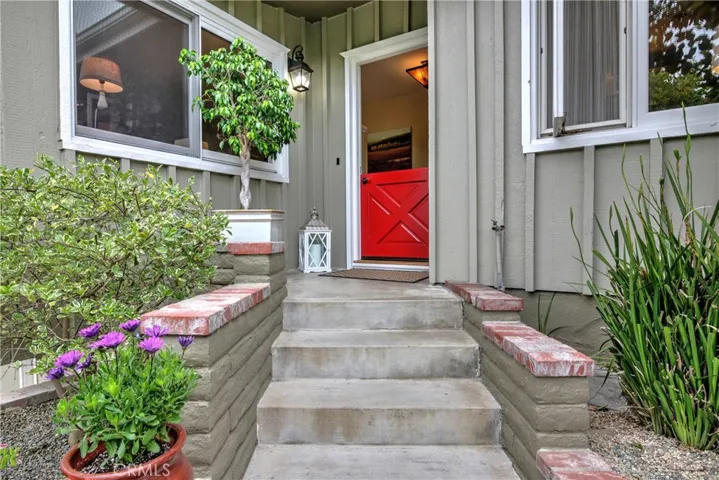 A bright red dutch door greets you at this lovely beach cottage.