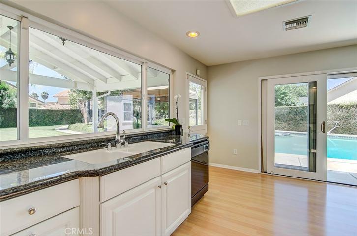 Windows, sliders, and two skylights all around the kitchen to bring in wonderful natural light.