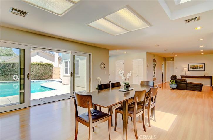 Kitchen, dining area, and family room all open up down a long spacious stretch.