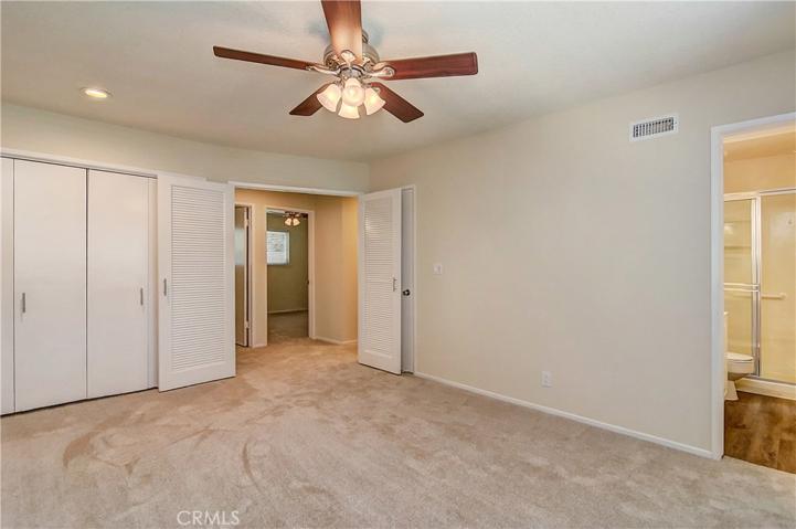 Spacious master has large wardrobe closet and spotless, upgraded ensuite bath with large shower.