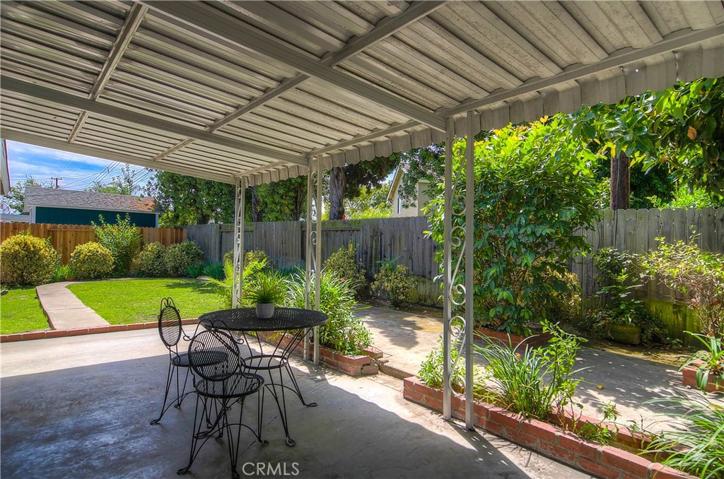 AHHHH...private rear yard is a true oasis in any weather...you can even enjoy the rain under this covered patio!