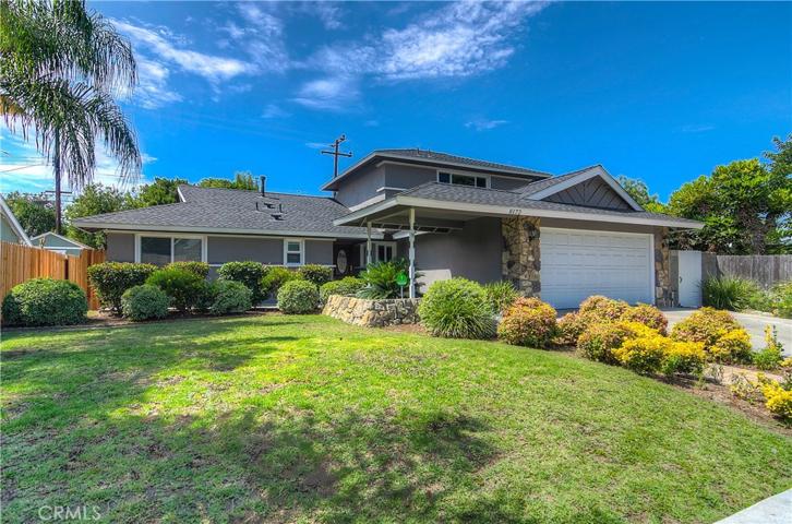 Deep set back from the street offers stately curb appeal and showcases the lovely architectural details.