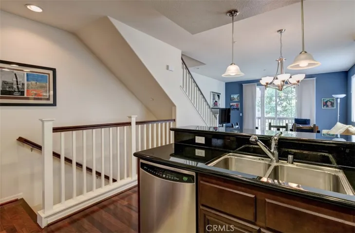 Down to garage and entry, one bedroom on middle floor and two bedrooms up stairs