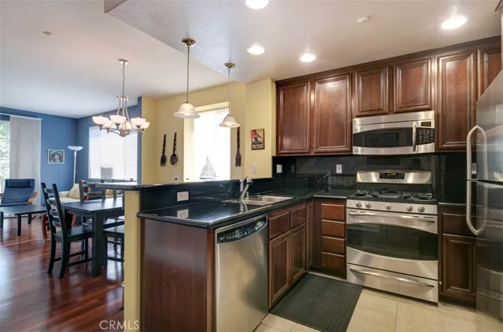 Modern kitchen with brushed stainless appliances included