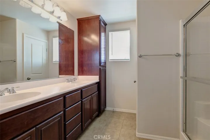 Master bedroom bath with twin sink vanity and walk in shower