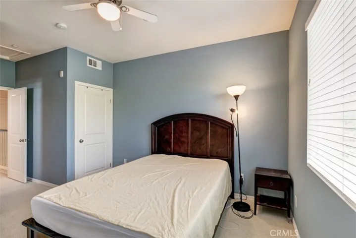 Master bedroom with walk in closet and twin wardrobe
