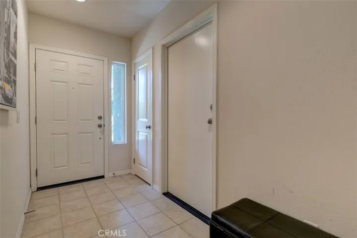 Front and garage entry with ceramic tiled floor