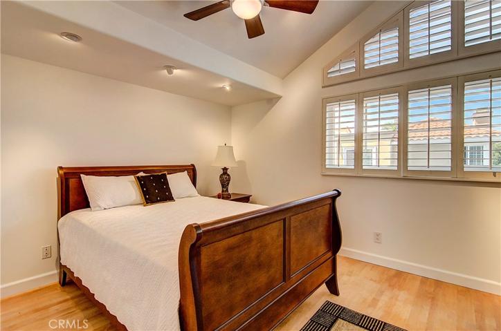 Versatile secondary bedroom...recessed lighting, shutters and volume ceiling too.