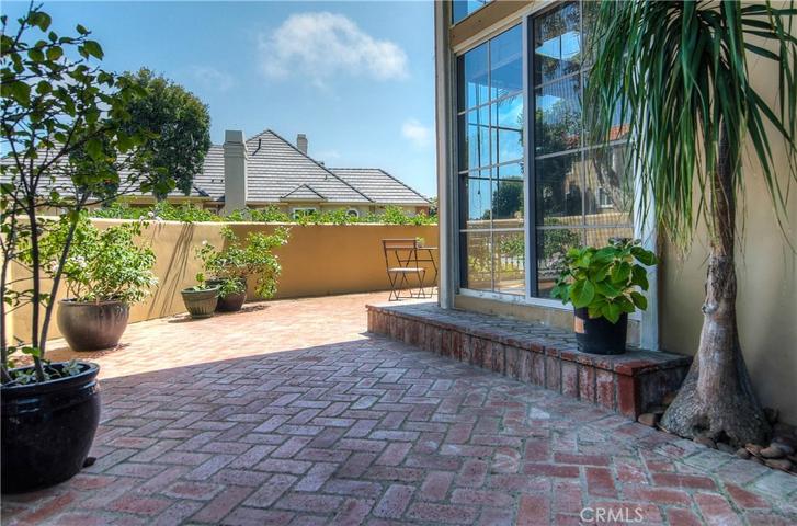 Overisze brick terrace is accessed from outside entry area as well as sliders from living room...primo party spot!