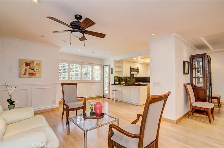 Separate family space is open to kitchen and has crisp white molding and wainscotting. Plus the  breakfast nook seats six easily- options galore!