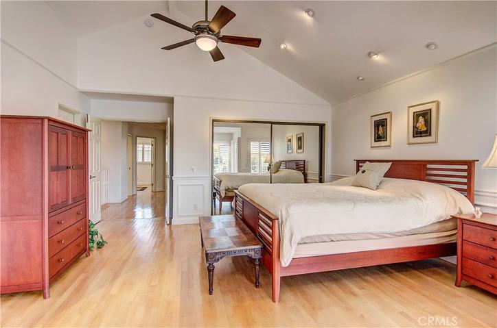 Volume ceiling adds nice detail to master suite....more hardwood floors upstairs...