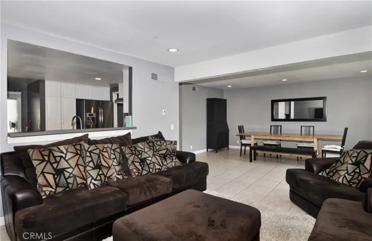 This angle you can see the Kitchen, Living Room, and Dining Room.