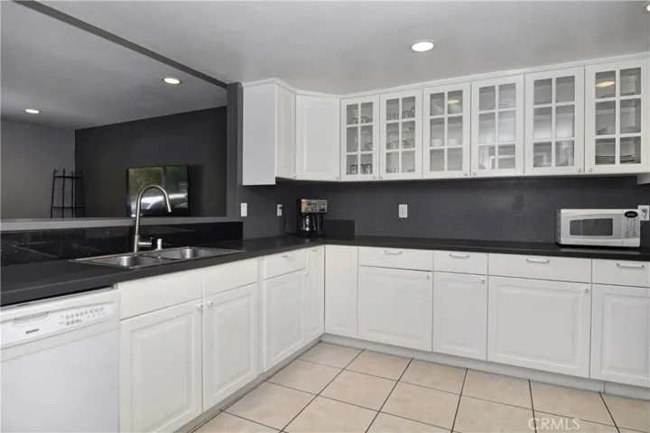 As you leave the half bathroom directly right across you will se the recently remodeled Kitchen!