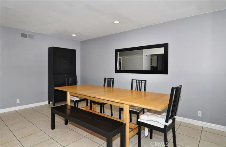 From this angle you see just how spacious the Dining Room is. This table can hold 8 people and yet there is still room for a larger table which is perfect for large gatherings.