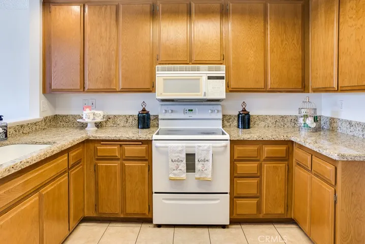 Abundance of cabinet storage and upgraded granite counter top space for comfortable cooking and meal prep.