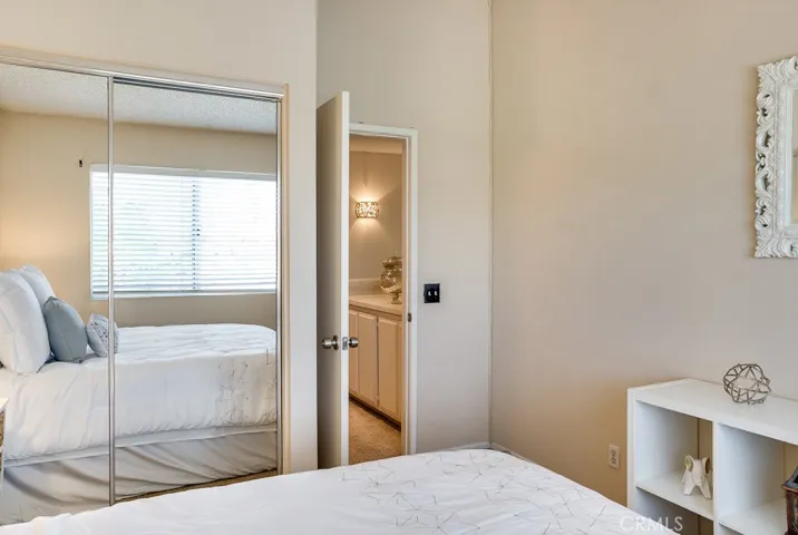Another view of 3rd bedroom with double panel mirrored wardrobe.