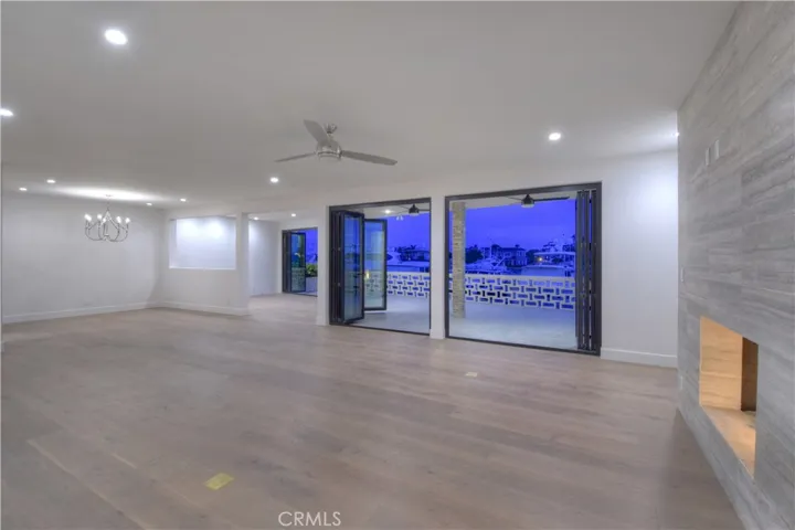 Living Room, Dining Room, Den/Office with try-quad folding doors