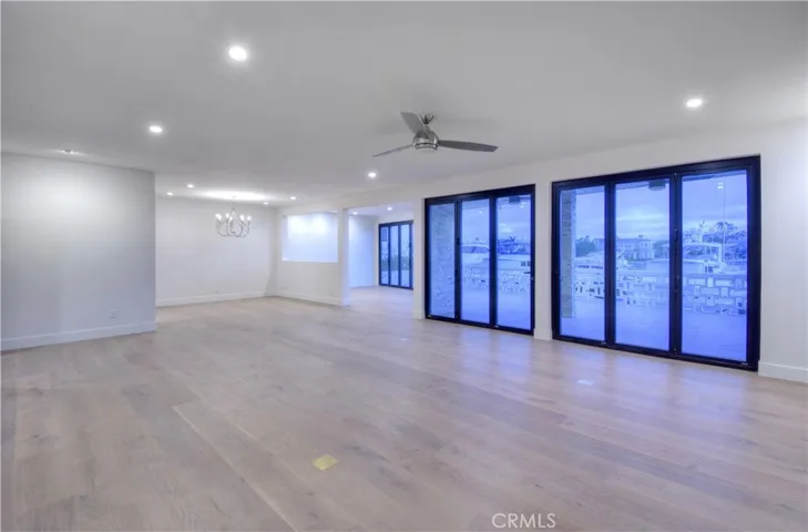 Open Living Room, Dining Room and Office/Den overlooking harbor
