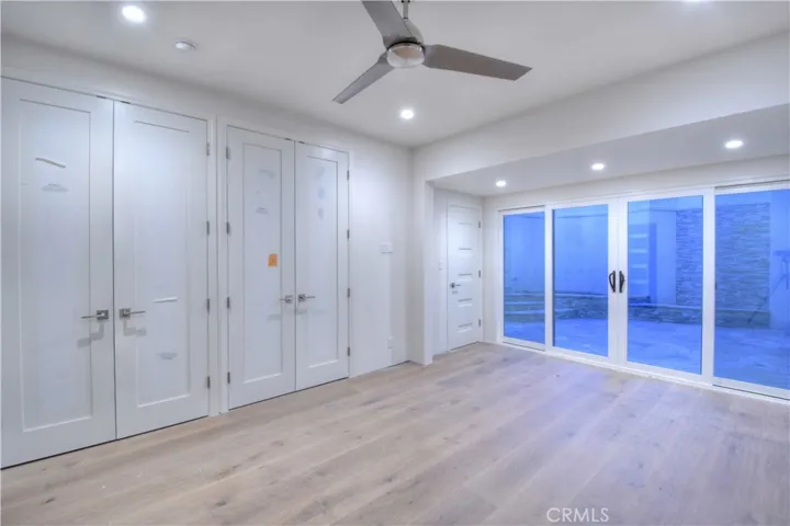 Guest Bedroom with built in closets and spacious patio access