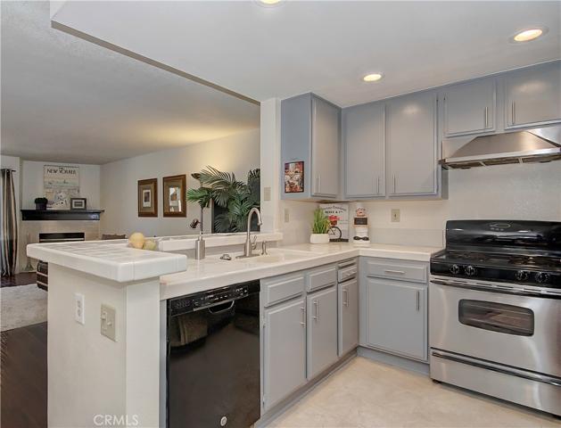 The chef is always part of the action in this open kitchen...nicely updated with stainless accents and LED lighting.