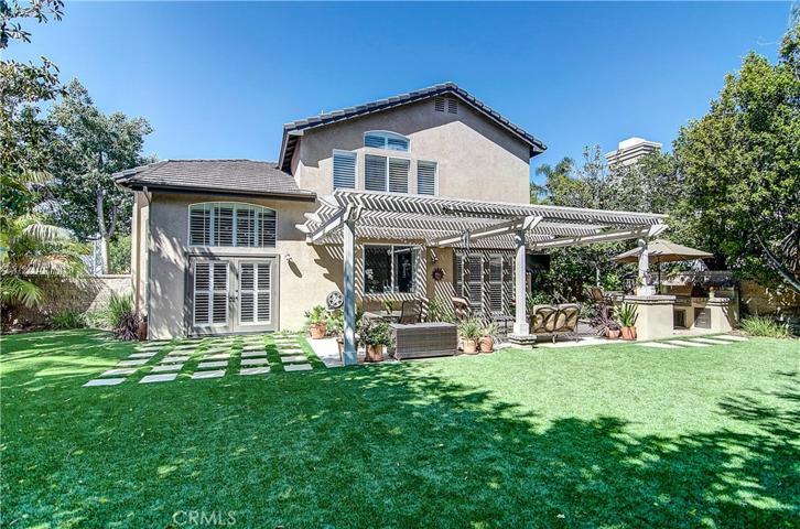 Estate size rear yard is surrounded by mature trees and is super private.