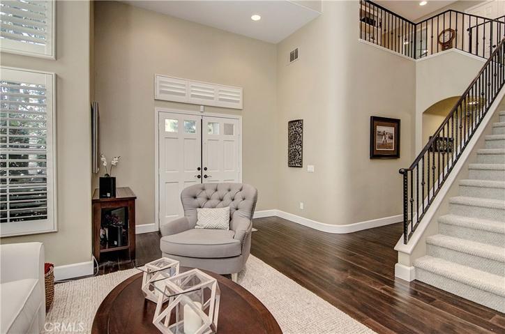 Double door entry, grand stair with custom iron railing and volume spaces with loads of sunlight say welcome to our home...in style!