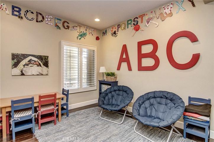 Main floor bedroom is also perfect for play room, media room or another home office space...full bath is just across the hall.
