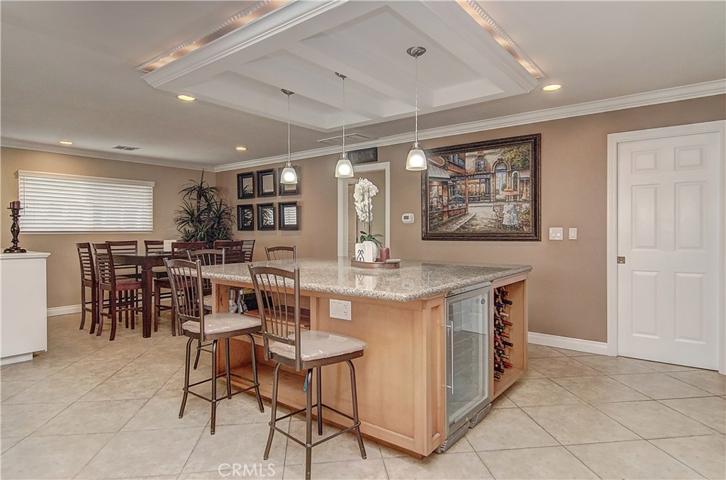 The hub of any home...this one knocks it out of the park!  Note wine fridge and storage too.