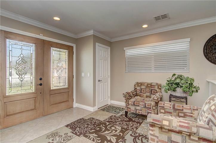 Gorgeous, leaded glass windows grace this double door entry.