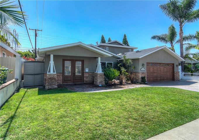 Great curb appeal with California Craftsman inspired porch and stonework.